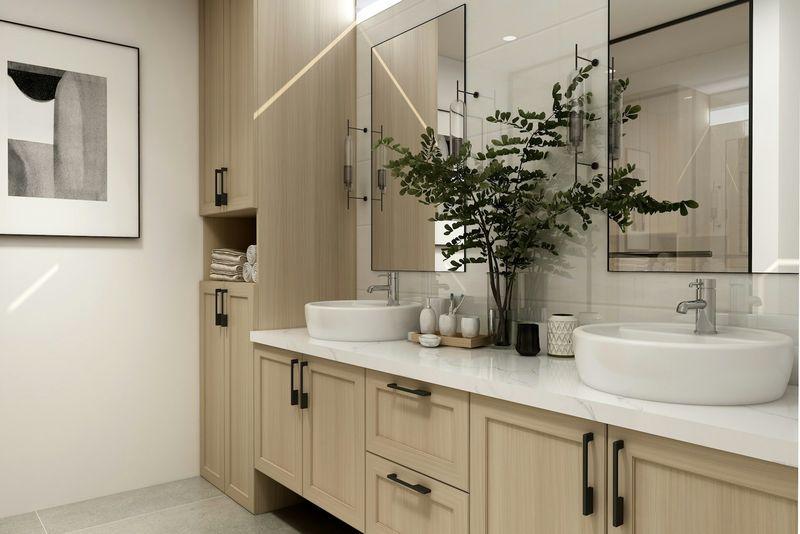 Light oak double vanity with twin vessel sinks and greenery in a bright bathroom