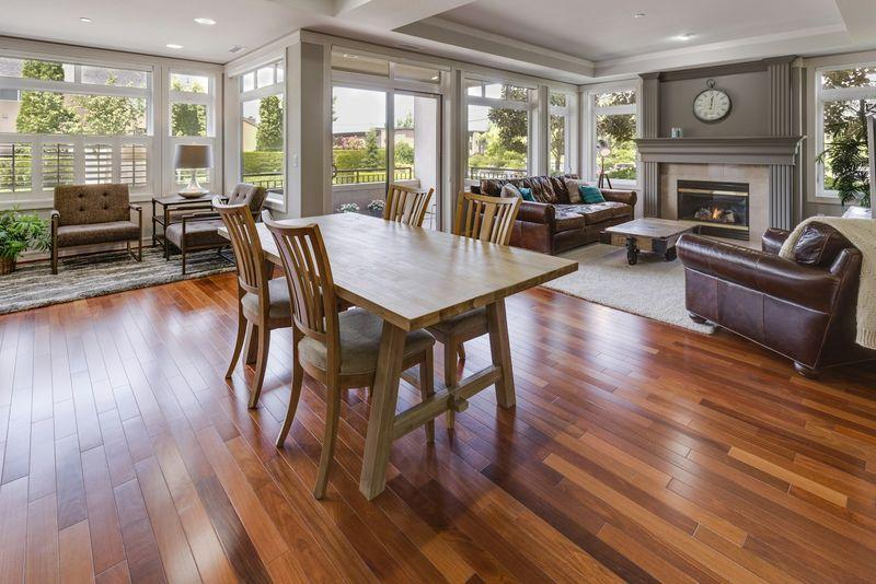 Rich cherry hardwood floor in bright sunlit dining and living room